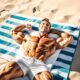 man tanning on beach